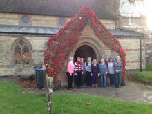 Front door of Stockton Church showing Poppies