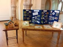 Bird boxes on display in church