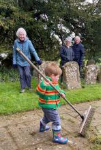 young child sweeping path